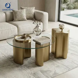 2026 Hot Sale Luxury Italian Design Wavy Gold Metal Base Tempered Glass Round Coffee Table Irregular Shape Side Table Set